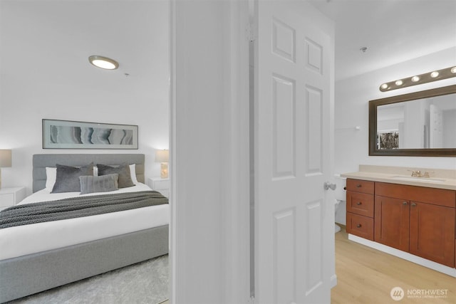 975 Aberdeen Ave NE Unit F407, Renton, WA 98056 - bedroom featuring light wood finished floors and a sink