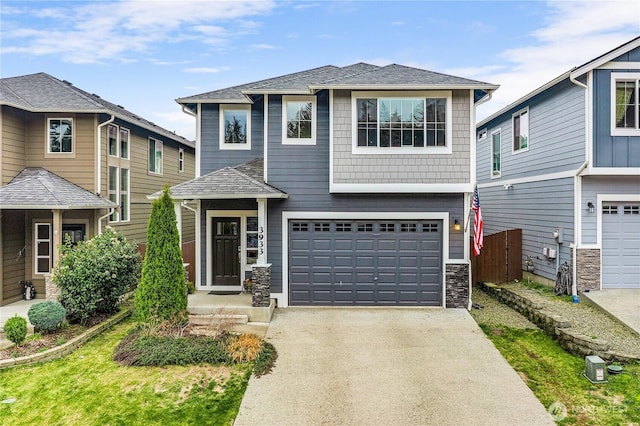 view of front of house featuring a garage, stone siding, roof with shingles, and driveway