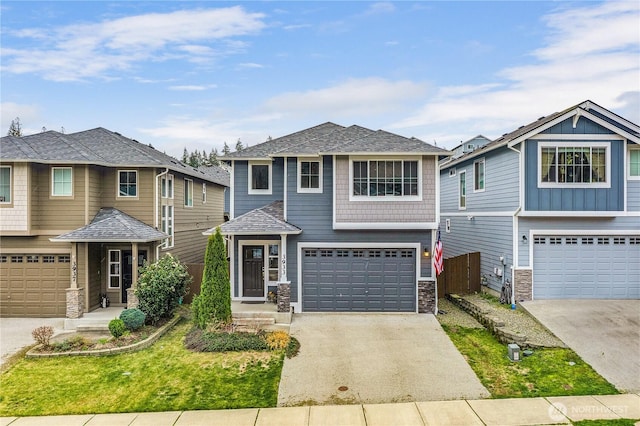 view of front of house featuring concrete driveway, an attached garage, stone siding, and a shingled roof