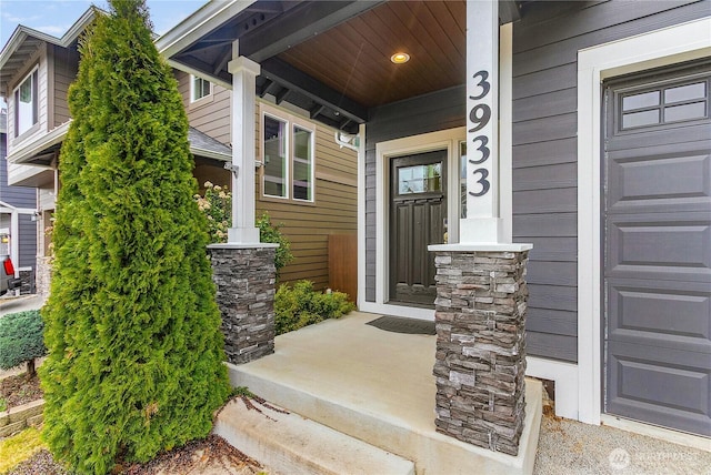 doorway to property featuring covered porch