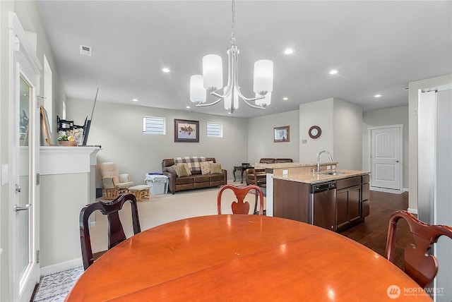 dining area with recessed lighting, visible vents, an inviting chandelier, and dark wood-style flooring