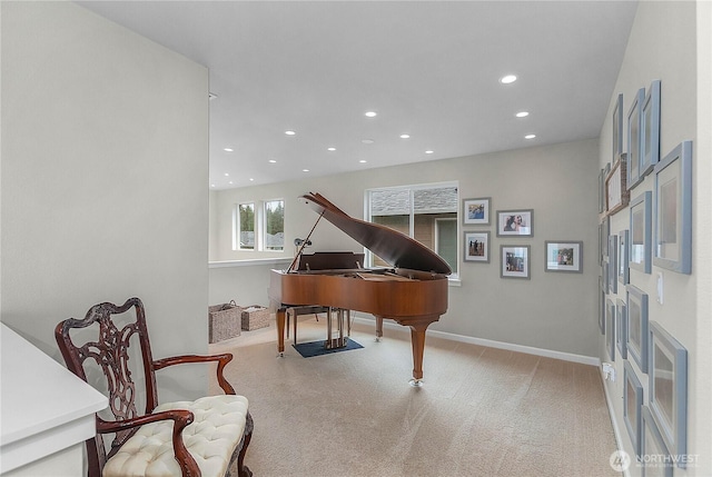 sitting room with carpet flooring, recessed lighting, and baseboards