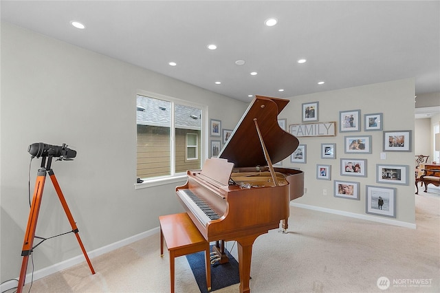 living area with recessed lighting, baseboards, and light colored carpet