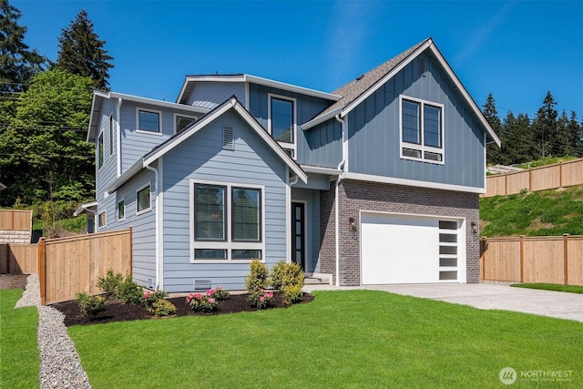 view of front of property featuring a front yard, fence, driveway, a garage, and brick siding