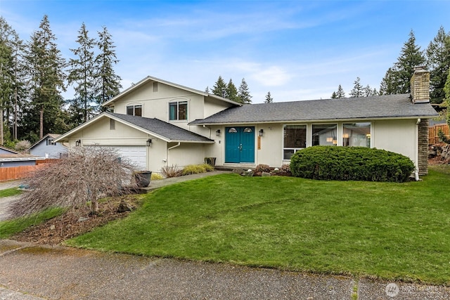 tri-level home featuring a front yard, roof with shingles, stucco siding, a chimney, and an attached garage