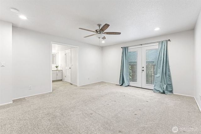 interior space with access to outside, french doors, carpet floors, and a textured ceiling