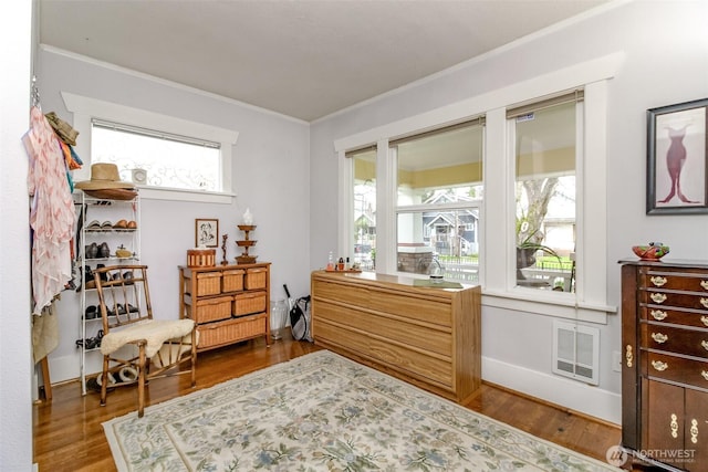2029 S 7th St, Tacoma, WA 98405 - living area with baseboards, wood finished floors, visible vents, and ornamental molding