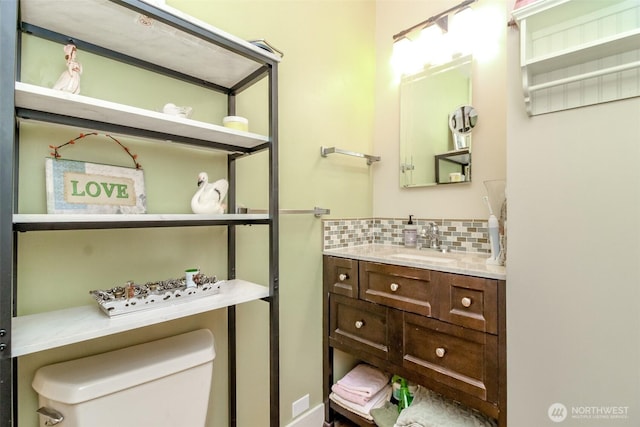 2029 S 7th St, Tacoma, WA 98405 - bathroom featuring vanity, toilet, and tasteful backsplash