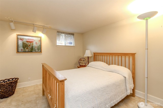 2029 S 7th St, Tacoma, WA 98405 - tiled bedroom featuring baseboards and track lighting