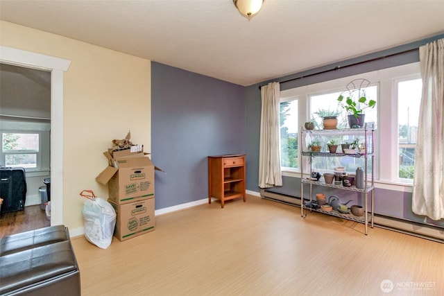 2029 S 7th St, Tacoma, WA 98405 - interior space with a wealth of natural light, a baseboard heating unit, baseboards, and wood finished floors