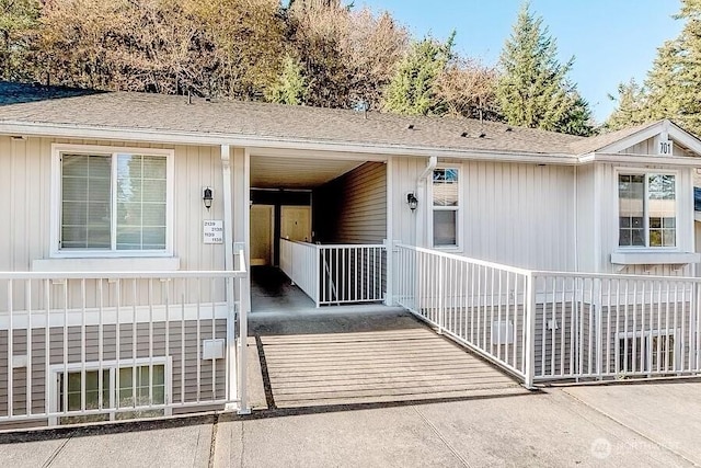 701 Harrington Pl SE Unit 1138, Renton, WA 98058 - view of exterior entry with covered porch and a shingled roof