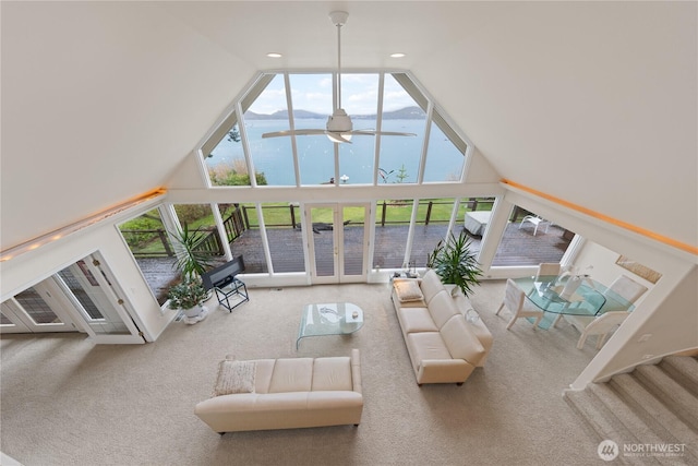 living area featuring recessed lighting, ceiling fan, high vaulted ceiling, and carpet