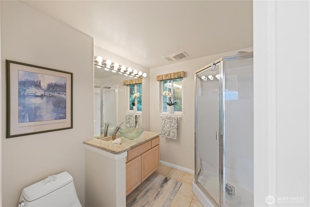 full bath with vanity, baseboards, visible vents, a stall shower, and toilet