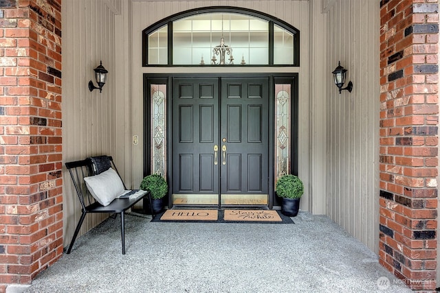 property entrance with brick siding