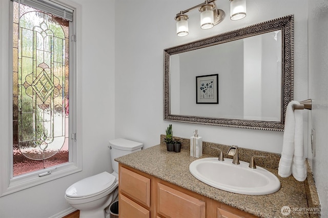 half bath with toilet and vanity