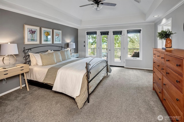 bedroom featuring baseboards, access to exterior, crown molding, carpet flooring, and a raised ceiling