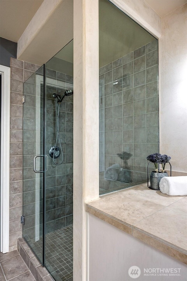 full bath featuring a stall shower