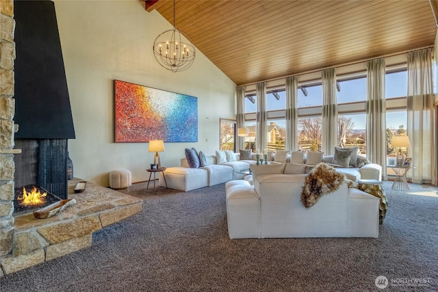 living area featuring an inviting chandelier, wooden ceiling, carpet flooring, and high vaulted ceiling