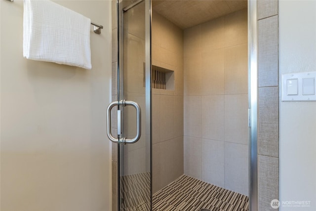 full bath with a shower stall