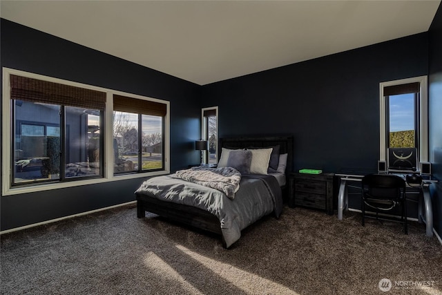 bedroom featuring vaulted ceiling, carpet, and baseboards