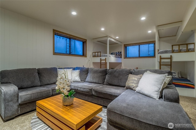 living area featuring recessed lighting and light carpet