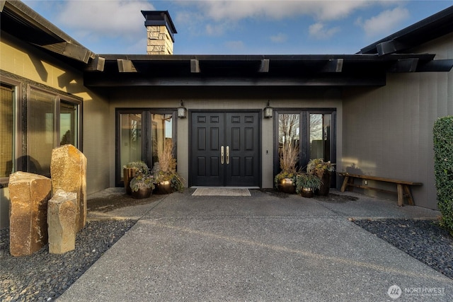 entrance to property with a chimney