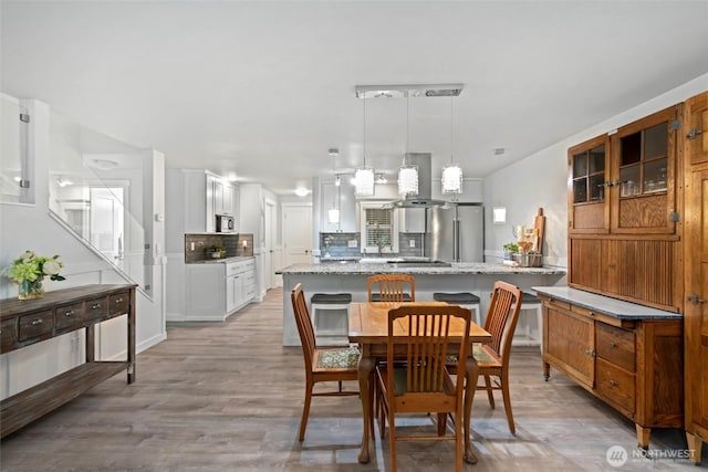 dining area with light wood finished floors