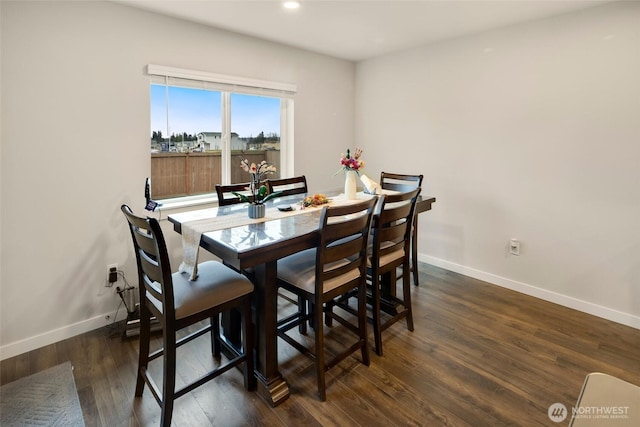 dining room with dark wood-type flooring, recessed lighting, and baseboards