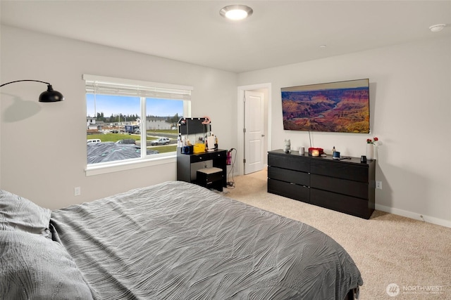 bedroom featuring baseboards and carpet floors