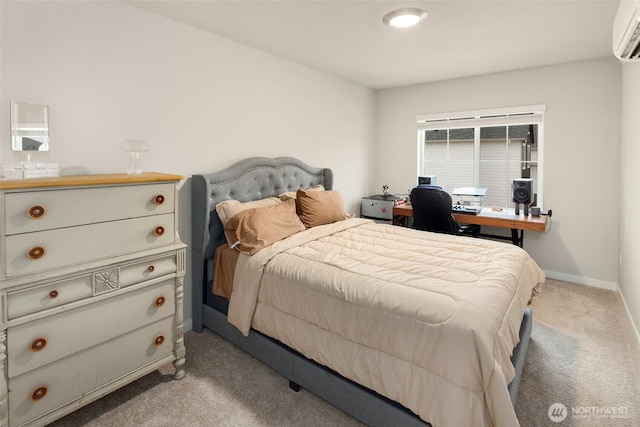 bedroom featuring light colored carpet, an AC wall unit, and baseboards