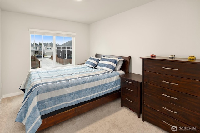 bedroom featuring light colored carpet