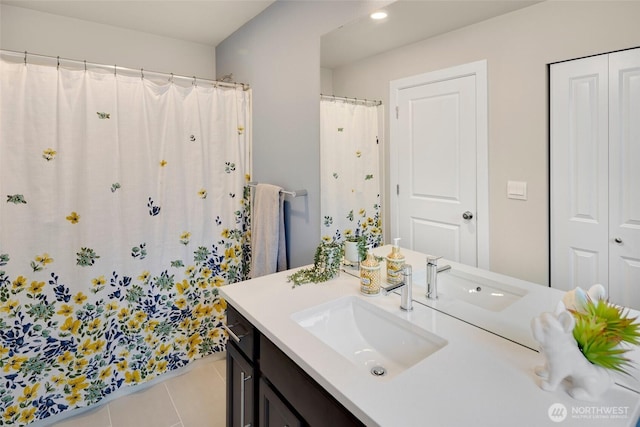 bathroom featuring vanity, a shower with shower curtain, and tile patterned flooring