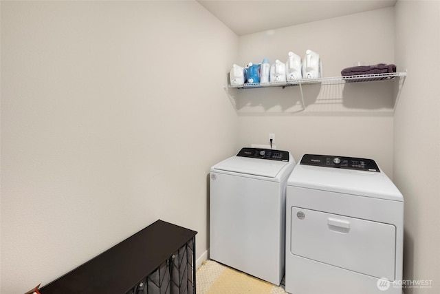 laundry room featuring independent washer and dryer and laundry area