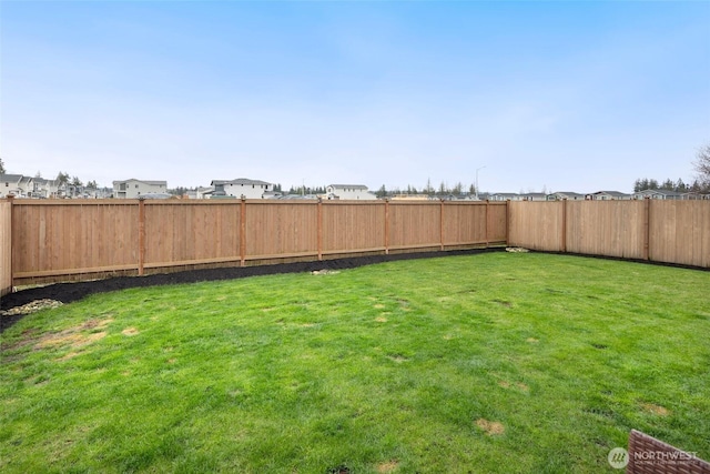 view of yard featuring a fenced backyard