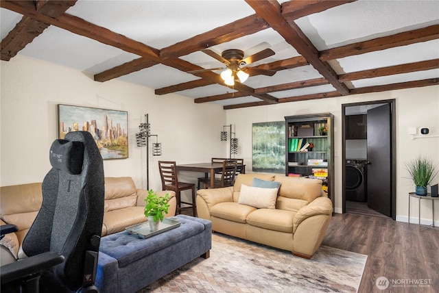 living area with beamed ceiling, washer / clothes dryer, coffered ceiling, and wood finished floors