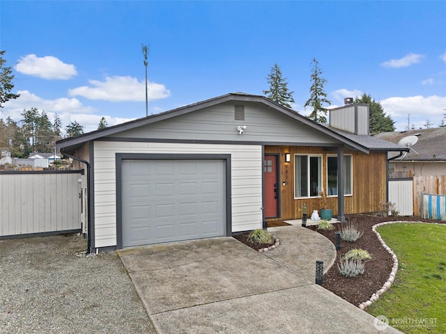 ranch-style home featuring an attached garage, a chimney, driveway, and fence