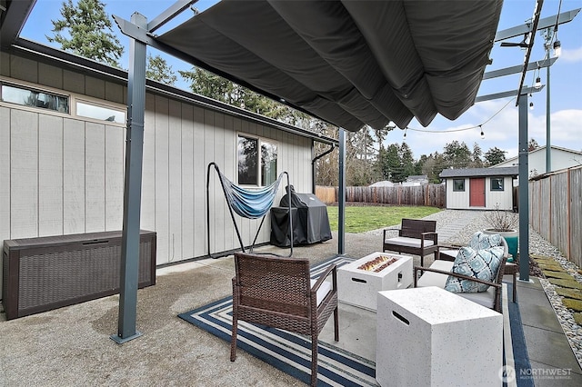 view of patio / terrace with an outbuilding, grilling area, an outdoor living space with a fire pit, and a fenced backyard