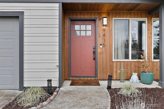 view of exterior entry featuring board and batten siding