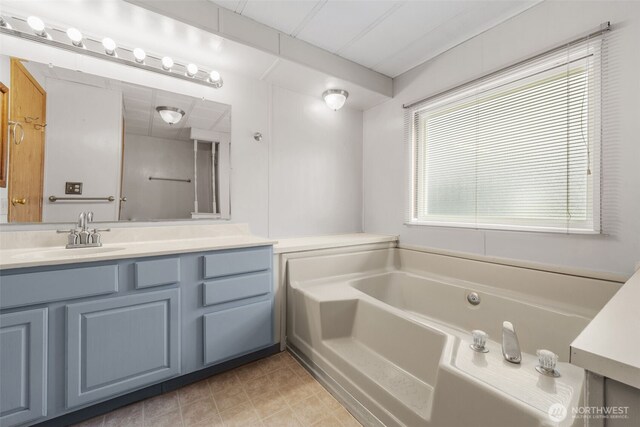 1402 22nd St NE Unit 402, Auburn, WA 98002 - bathroom featuring vanity and a garden tub