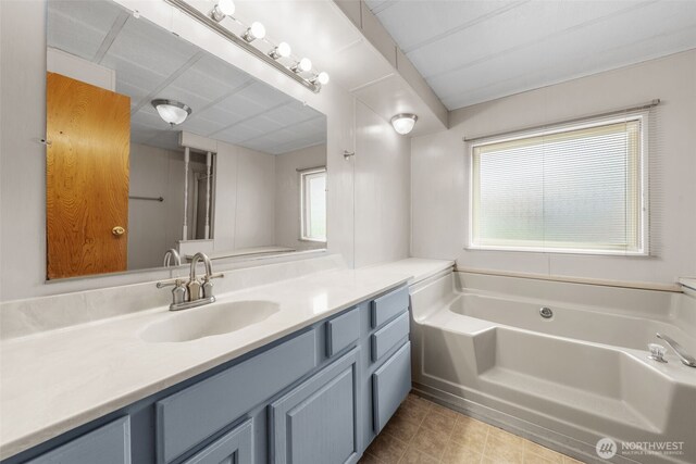 1402 22nd St NE Unit 402, Auburn, WA 98002 - bathroom featuring a bath and vanity