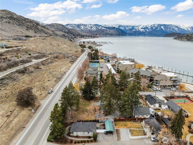 aerial view featuring a water and mountain view