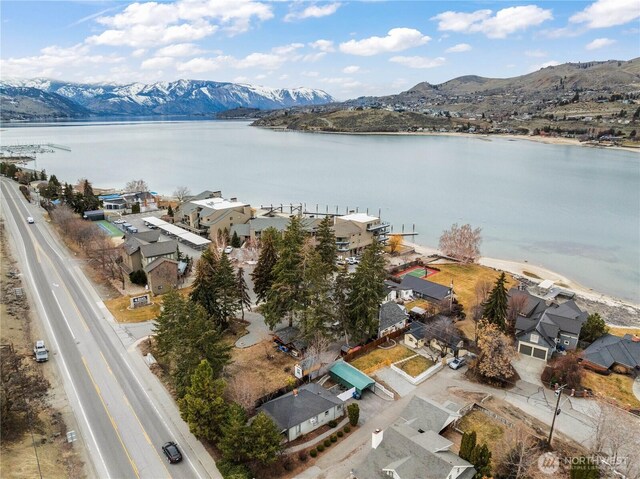 bird's eye view with a water and mountain view