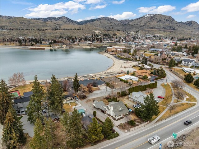 aerial view featuring a residential view and a water and mountain view