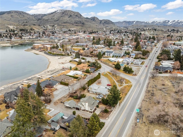 bird's eye view with a residential view and a water and mountain view