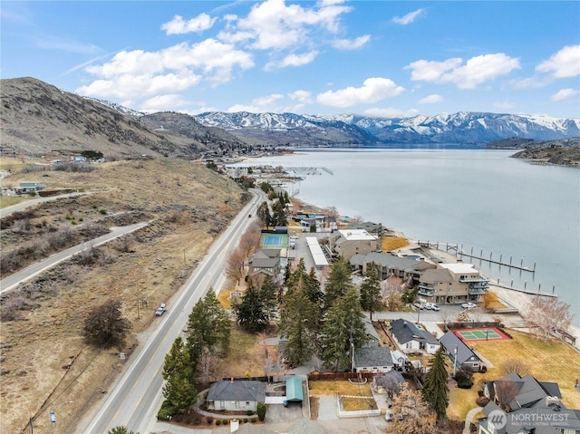 aerial view featuring a water and mountain view