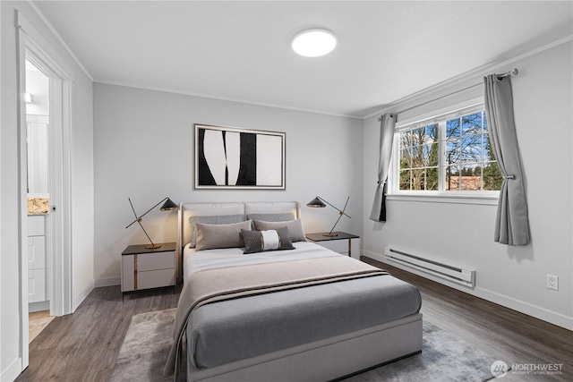 bedroom with ornamental molding, wood finished floors, baseboards, and a baseboard radiator