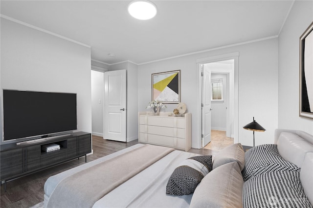 bedroom with baseboards, wood finished floors, and ornamental molding