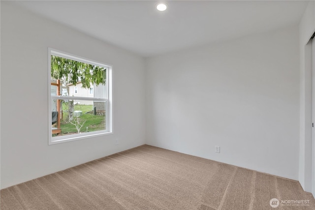 carpeted spare room with recessed lighting