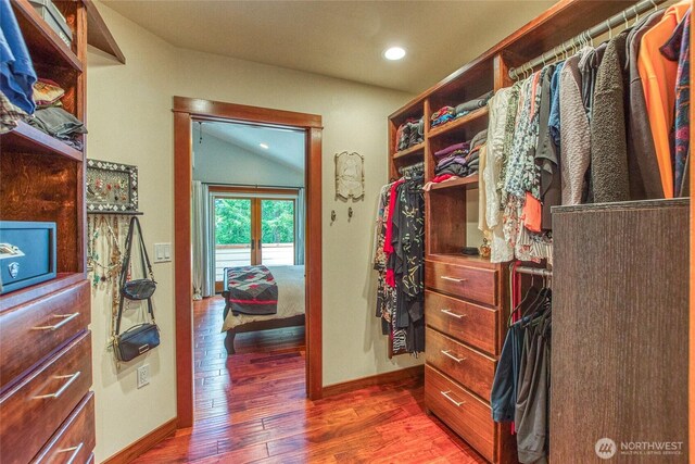 spacious closet with wood finished floors and french doors