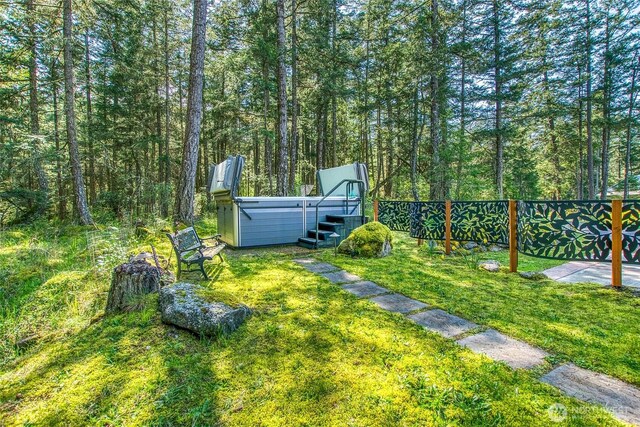 view of yard featuring a wooded view
